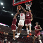 Dunn scores 16, Temple defeats No. 1 Houston 56-55