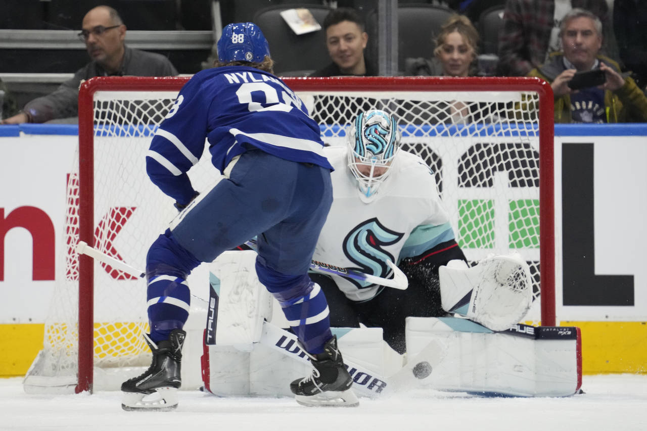 Seattle Kraken goaltender Martin Jones (30) stops Toronto Maple Leafs right wing William Nylander (...