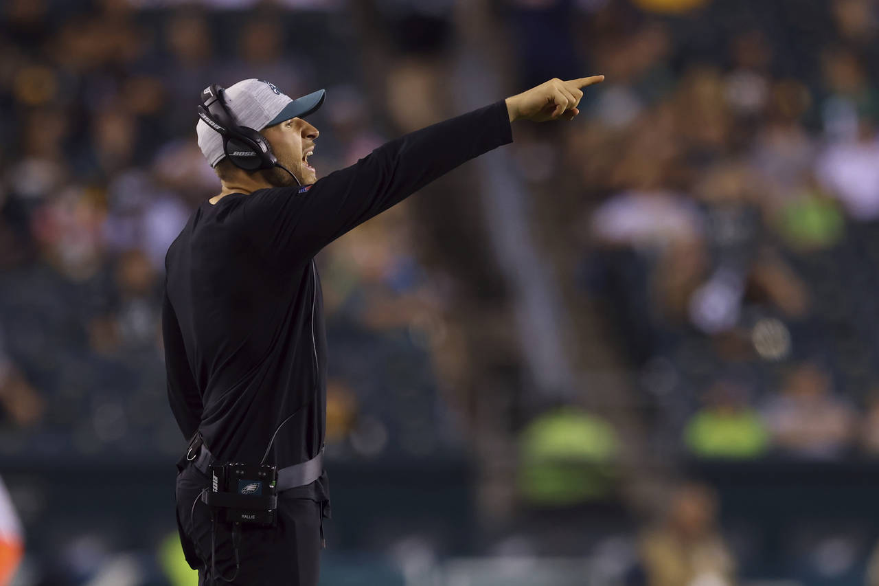 FILE - Philadelphia Eagles linebackers coach Nick Rallis gestures during a preseason NFL football g...