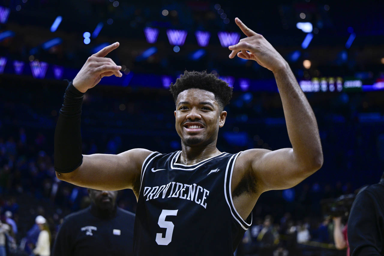 Providence's Ed Croswell celebrates a victory after an NCAA college basketball game against Villano...