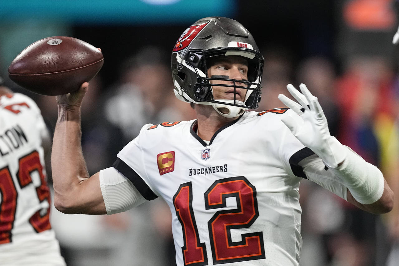 Tampa Bay Buccaneers quarterback Tom Brady (12) sets back to pass during the first half of an NFL f...