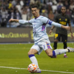 Bruised Ronaldo scores twice to edge showdown with Messi