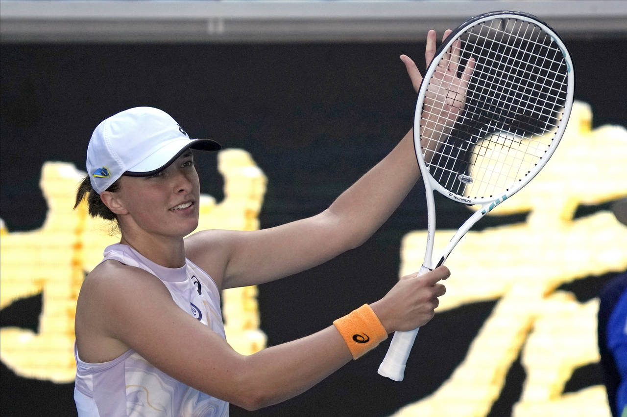 Iga Swiatek of Poland waves after defeating Cristina Bucsa of Spain during their third round match ...