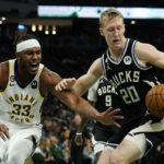 Holiday sparks late rally as Bucks beat Pacers 132-119