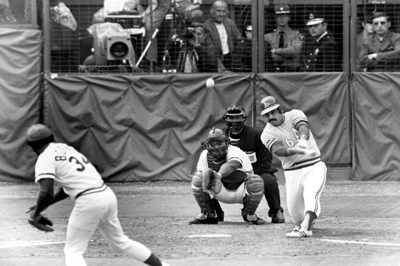 FILE - Oakland Athletics Sal Bando slams a double to center field in the sixth inning to score team...