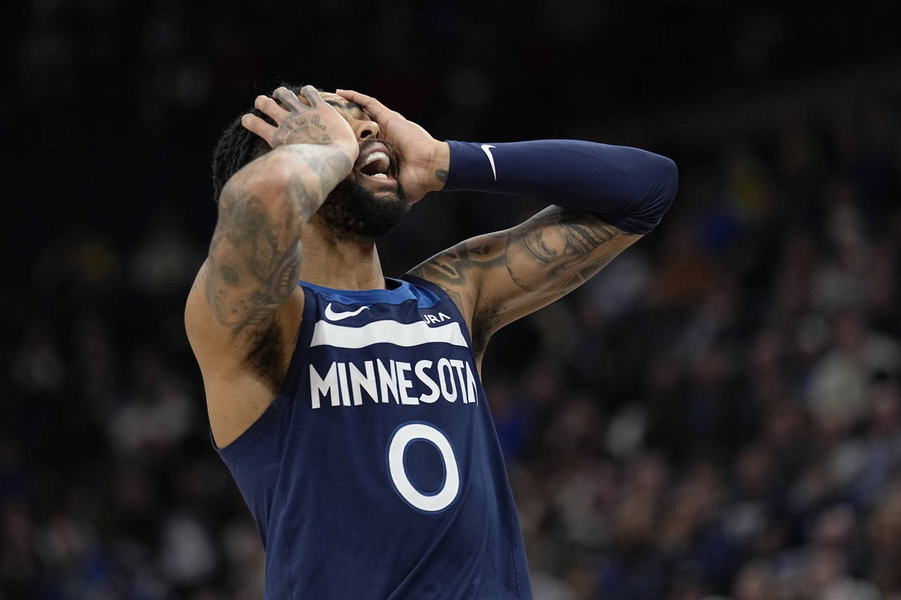 Minnesota Timberwolves guard D'Angelo Russell (0) reacts to a foul call during the second half of a...