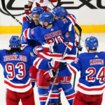 Rangers score 3 in 3rd to stop Hurricanes' win streak at 11