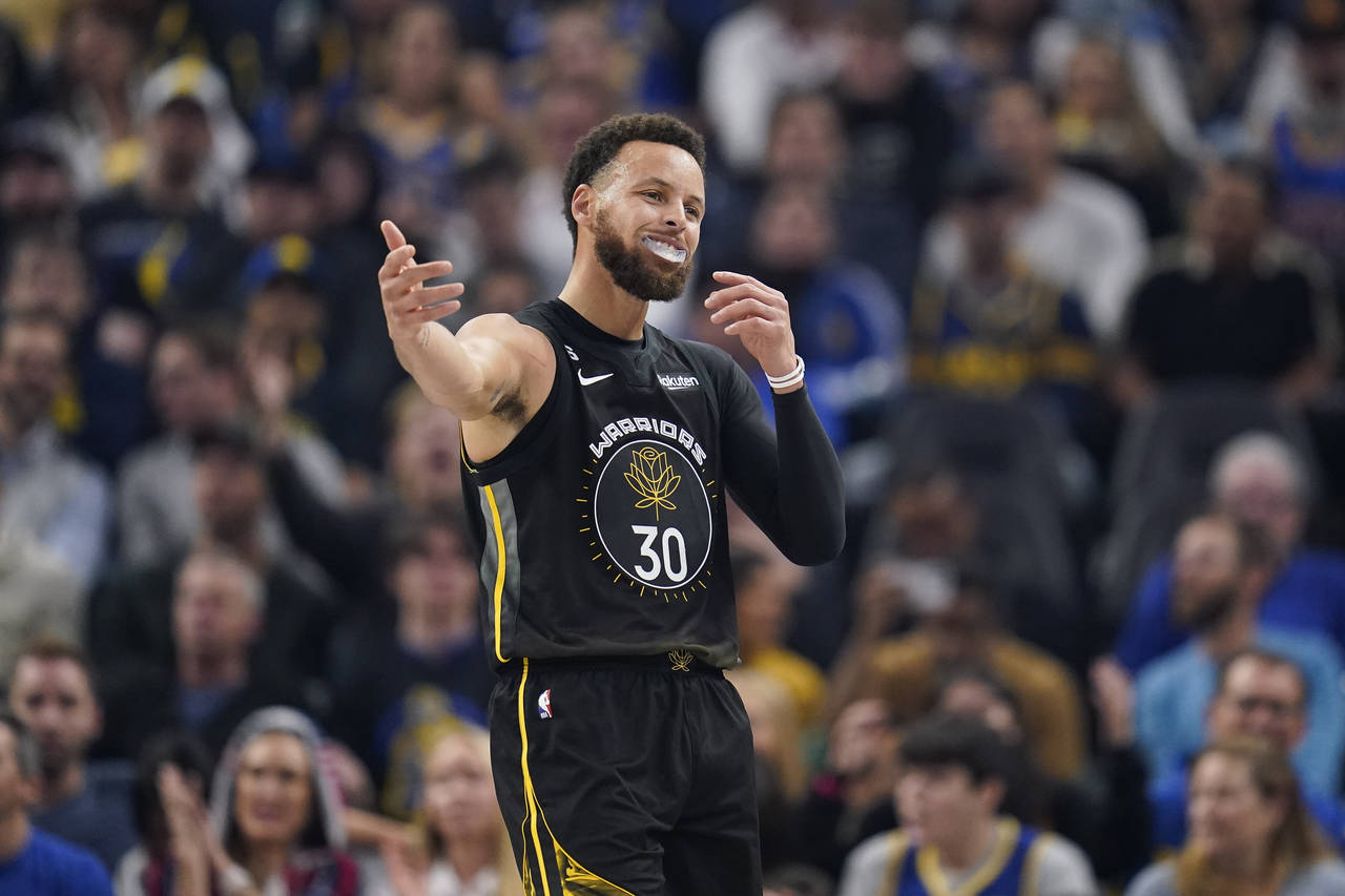 Golden State Warriors guard Stephen Curry reacts during the first half of the team's NBA basketball...
