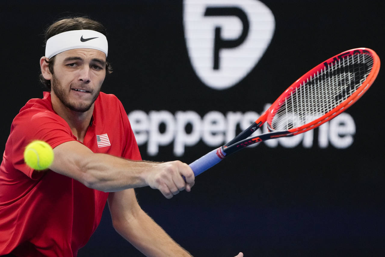 United States' Taylor Fritz plays a backhand return to Italy's Matteo Berrettini during the final o...