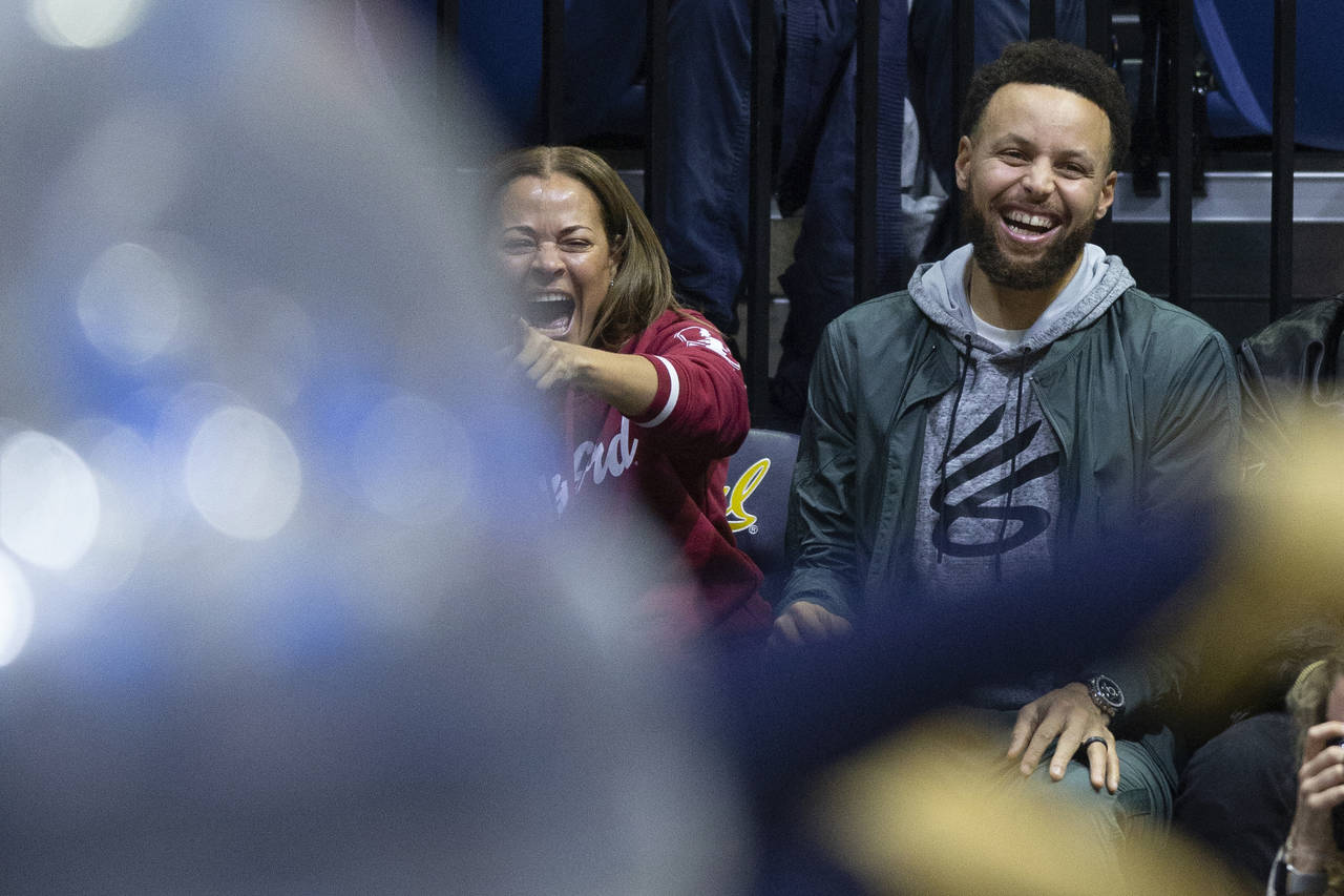 Sonya Curry, left, and her son, Golden State Warriors star Stephen Curry, laugh at a student compet...