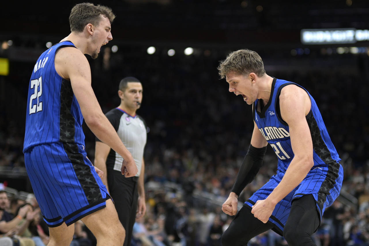 Orlando Magic forward Franz Wagner (22) and center Moritz Wagner (21) celebrate after Moritz Wagner...