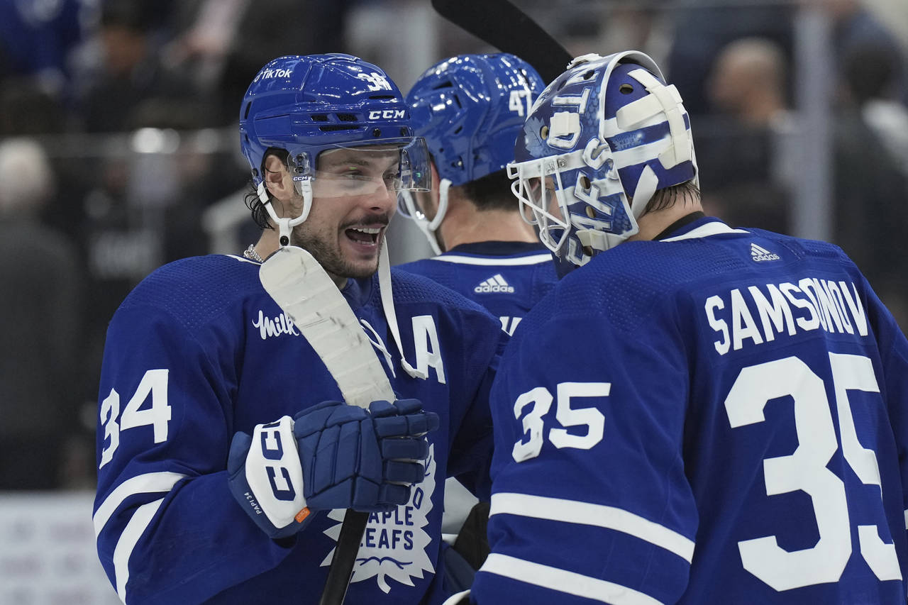 Toronto Maple Leafs center Auston Matthews (34) and goaltender Ilya Samsonov (35) celebrate their w...