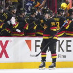 Canucks beat Blackhawks 5-2 in Tocchet's debut as coach