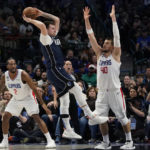 Leonard, George lead Clippers past Mavericks, 112-98