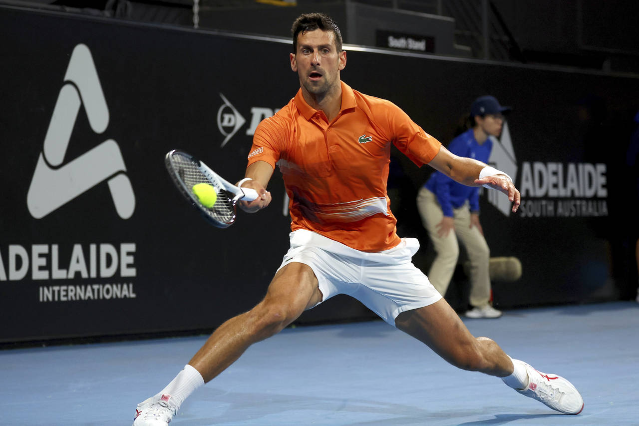 Serbia's Novak Djokovic makes a forehand return to Canada's Denis Shapovalov during their quarter f...