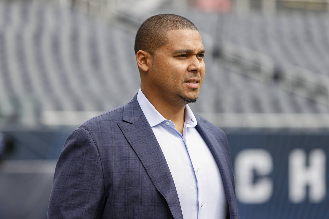 FILE - Chicago Bears NFL football team general manager Ryan Poles walks on the field prior to an NF...