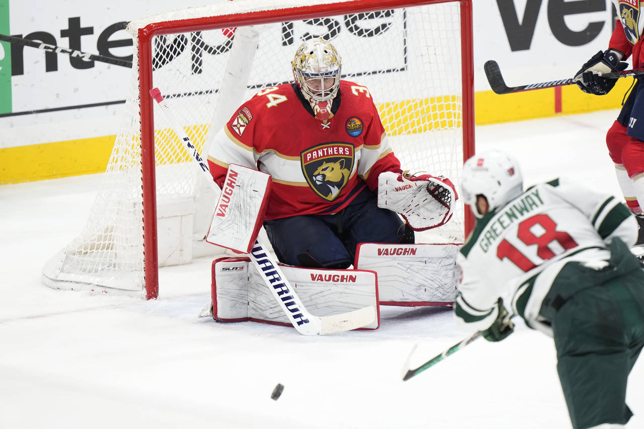 Minnesota Wild left wing Jordan Greenway (18) attempts a shot at Florida Panthers goaltender Alex L...