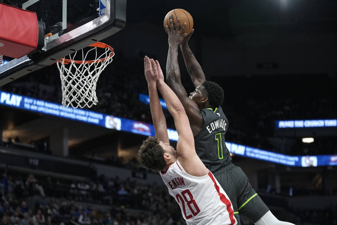 Minnesota Timberwolves guard Anthony Edwards (1) dunks against Houston Rockets center Alperen Sengu...