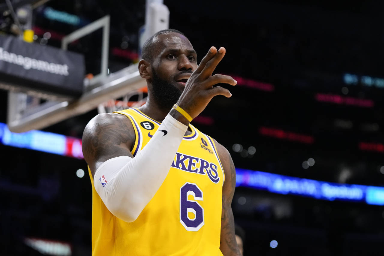 Los Angeles Lakers' LeBron James (6) reacts after making a basket and drawing a foul during the fir...