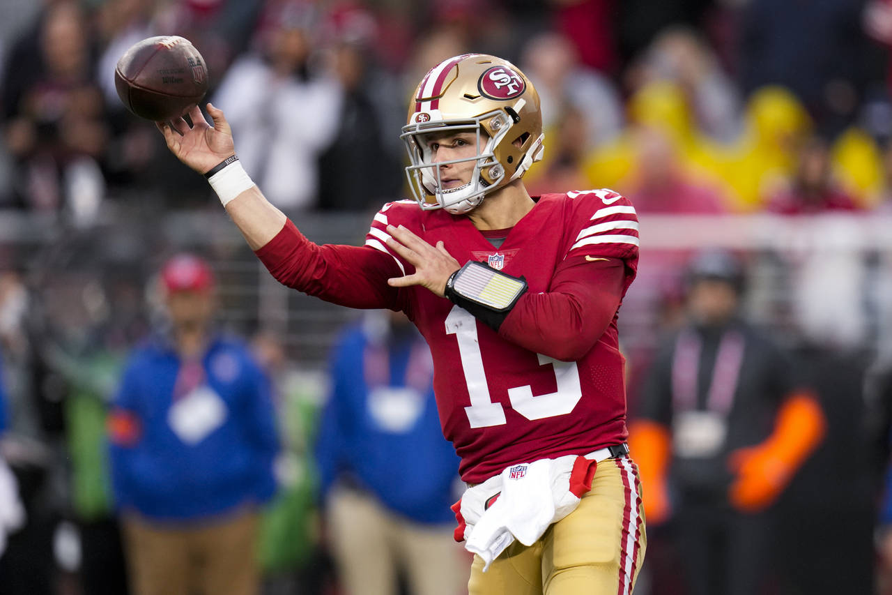 San Francisco 49ers quarterback Brock Purdy (13) passes against the Seattle Seahawks during the sec...