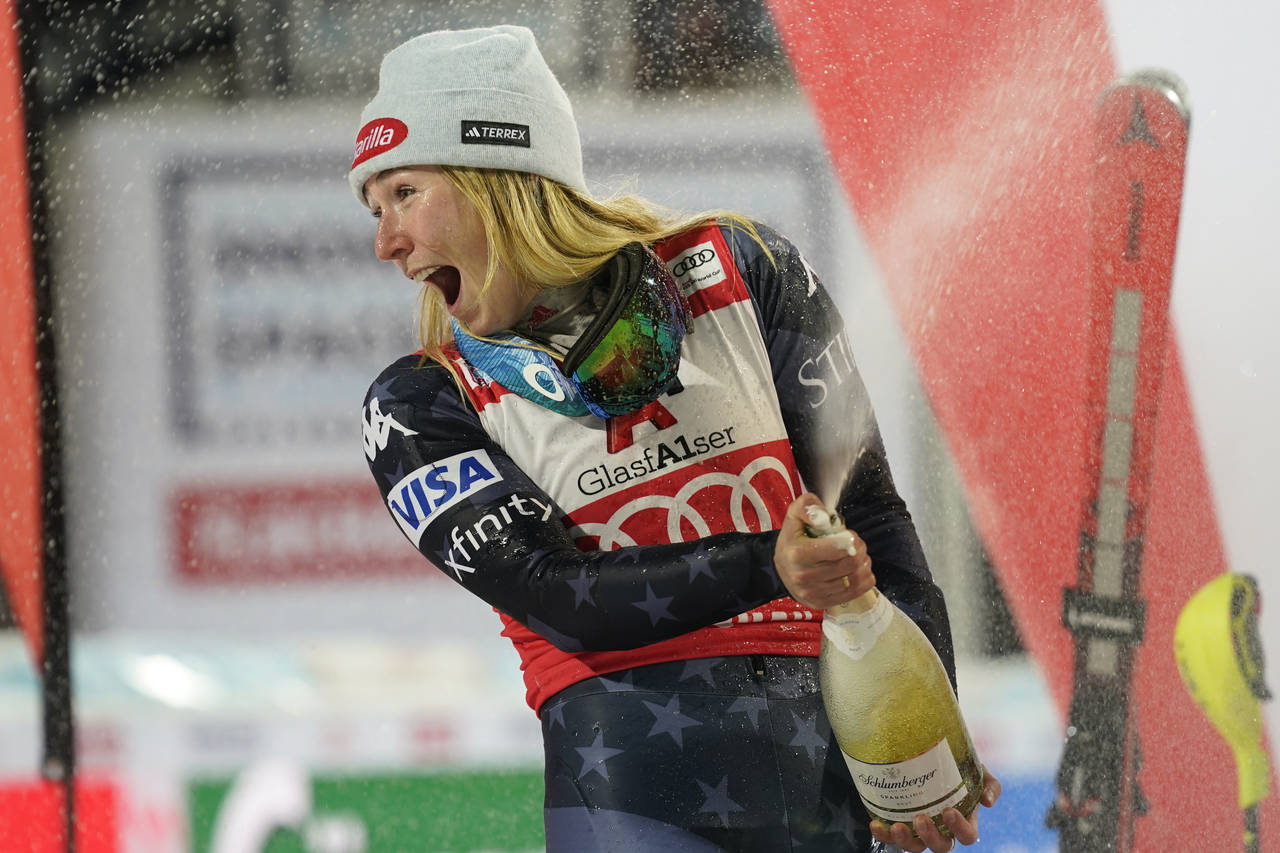 United States' Mikaela Shiffrin celebrates on podium after finishing second in a alpine ski, women'...