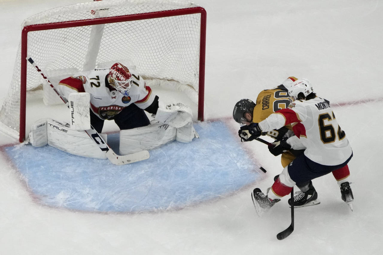 Vegas Golden Knights left wing William Carrier (28) scores on Florida Panthers goaltender Sergei Bo...