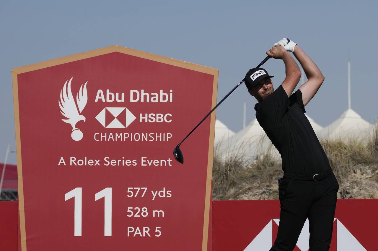 Victor Perez of France tees off on the 11th hole during the final round of Abu Dhabi HSBC Golf Cham...