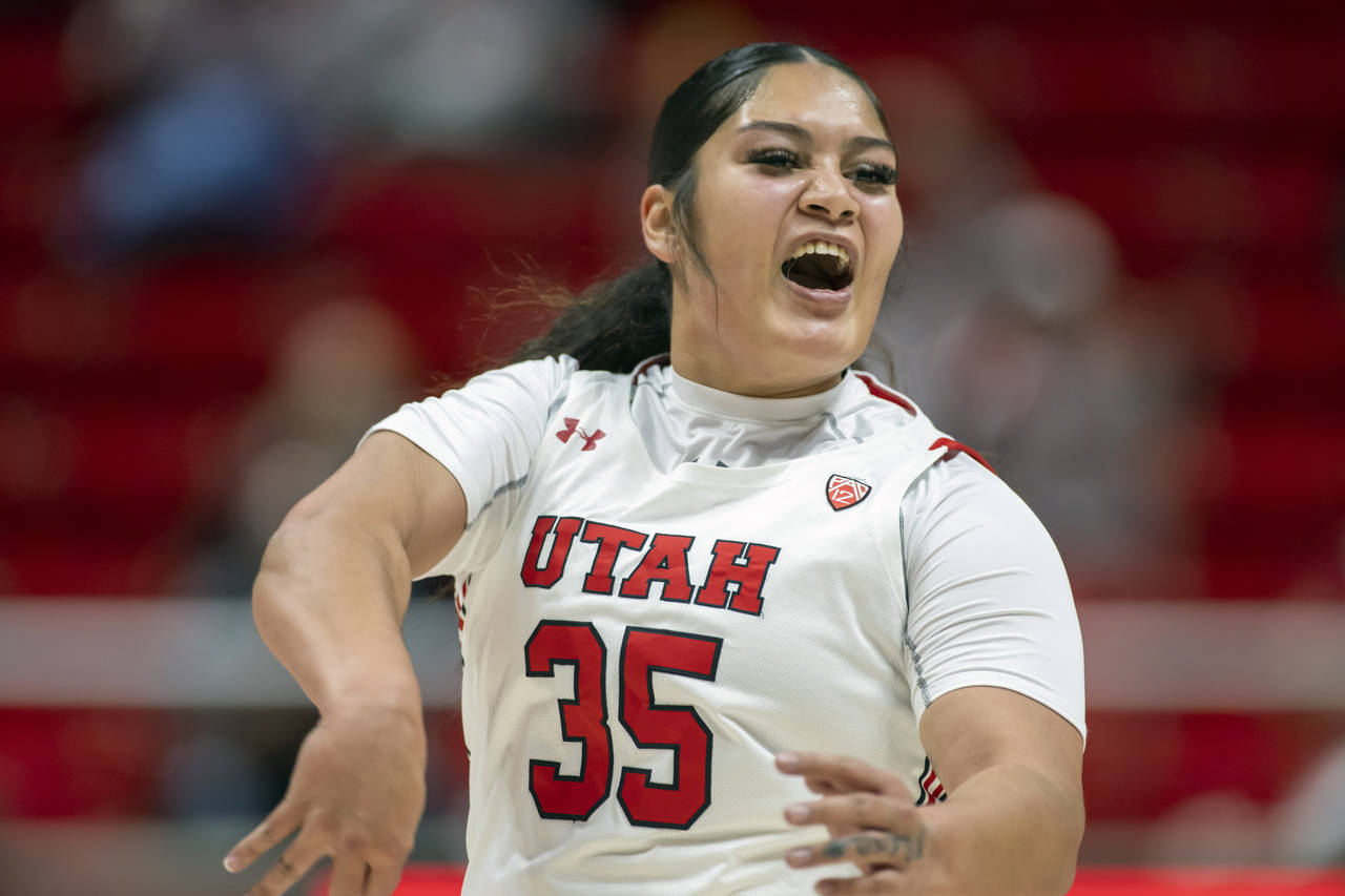 FILE - Utah forward Alissa Pili (35) celebrates a basket during an NCAA basketball game against Okl...