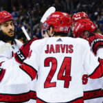 Rangers score 3 in 3rd to stop Hurricanes' win streak at 11