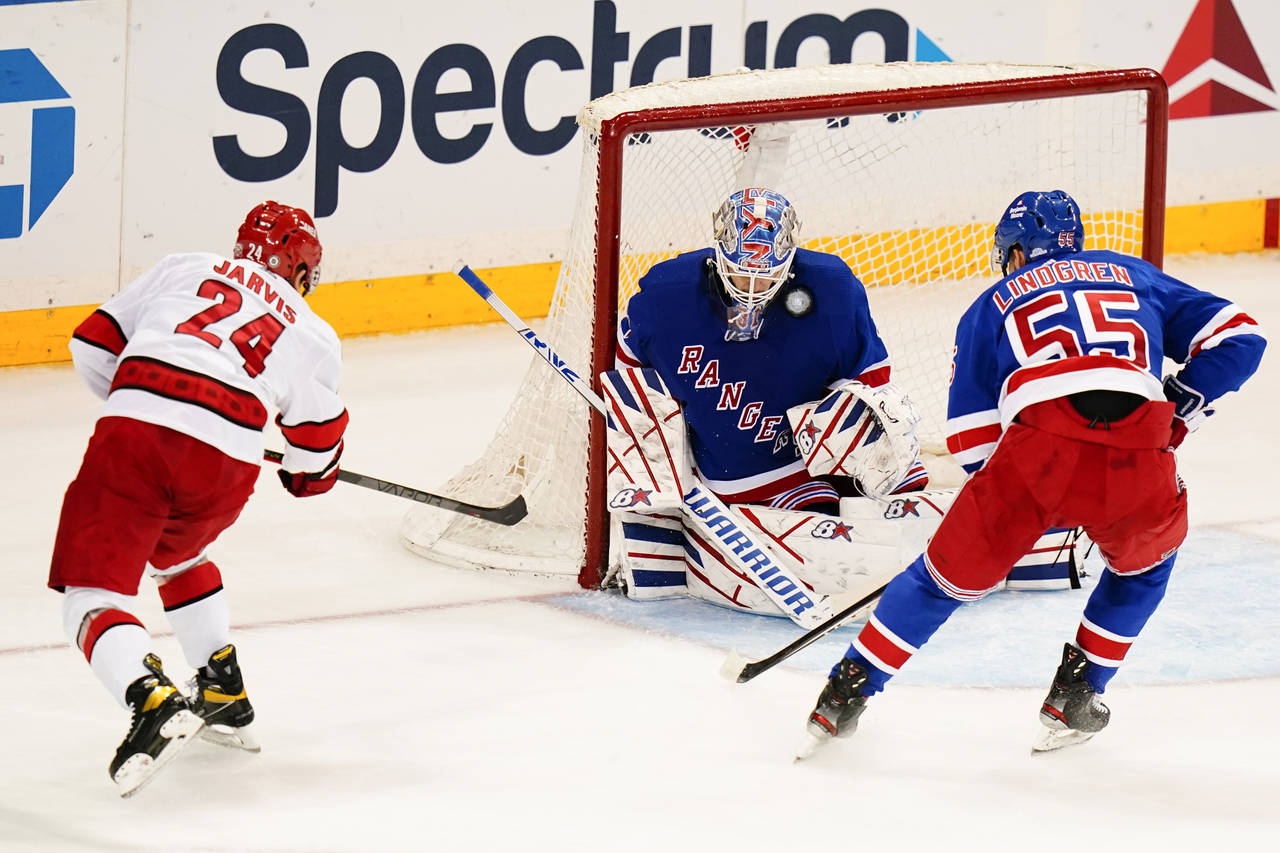 New York Rangers goaltender Igor Shesterkin (31) stops a shot on goal by Carolina Hurricanes' Seth ...