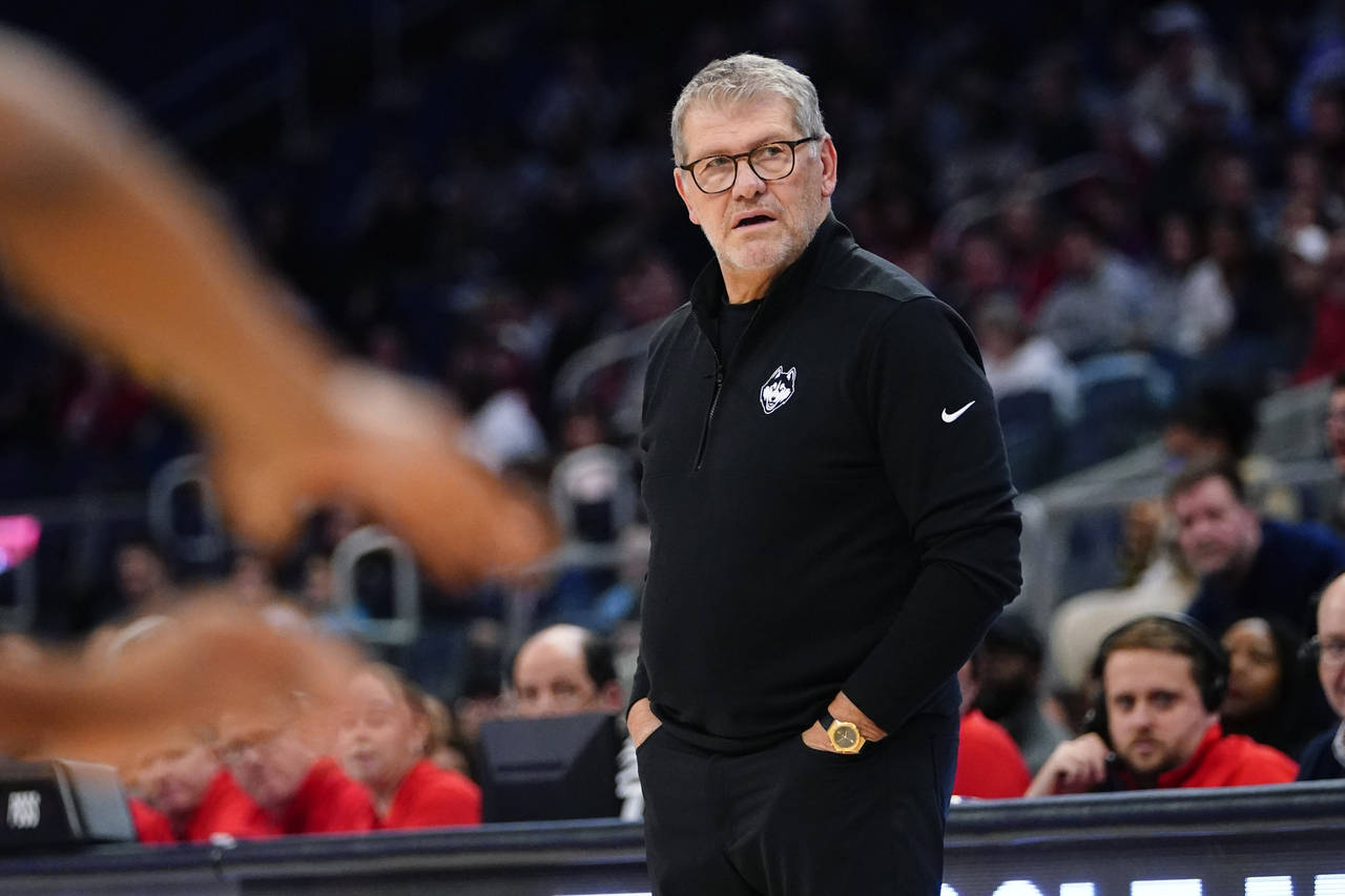 Connecticut head coach Geno Auriemma watches his team during the first half of an NCAA basetball ga...