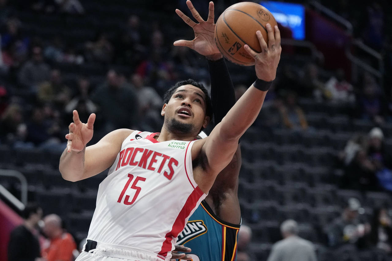 Houston Rockets guard Daishen Nix (15) makes a layup during the second half of an NBA basketball ga...