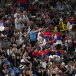 Novak Djokovic gets warm Australian Open welcome, then wins