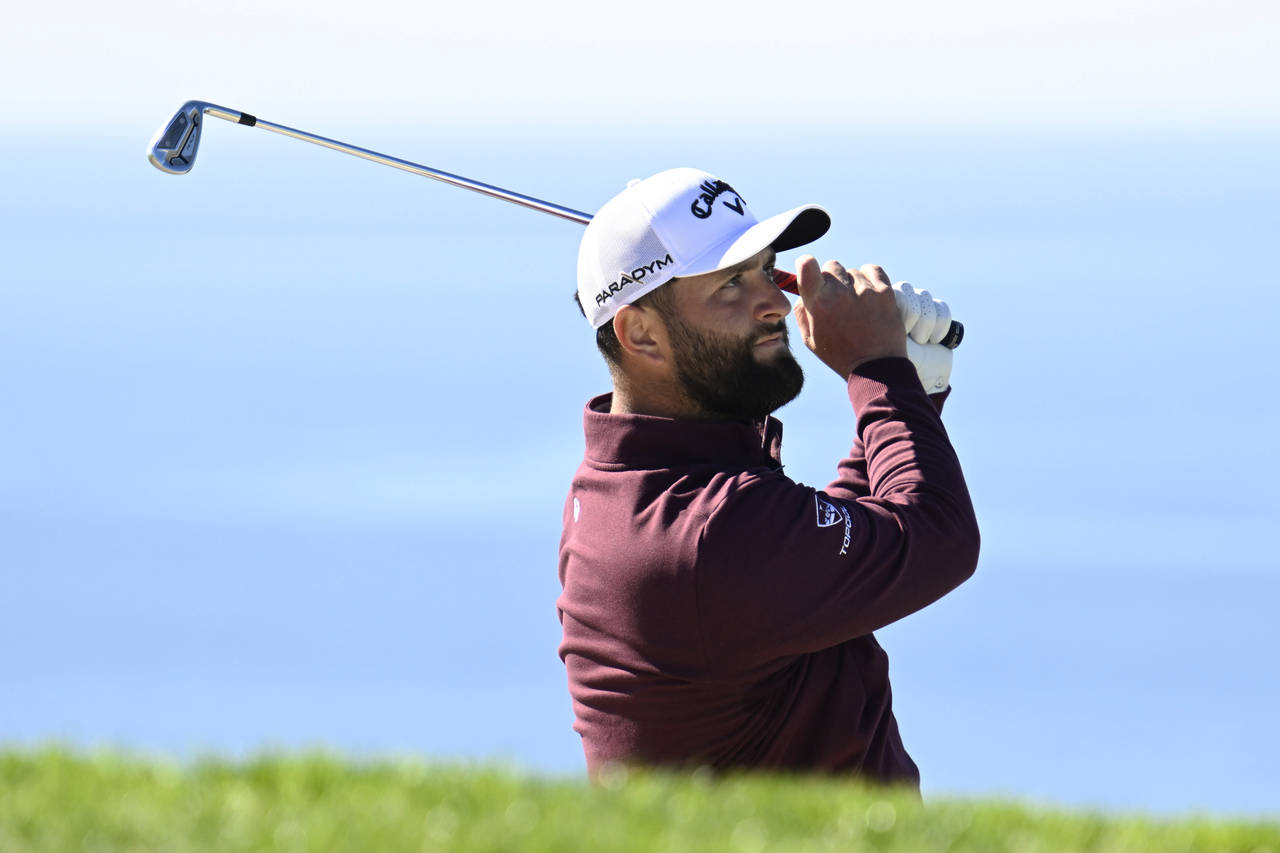 Jon Rahm, of Spain, watches his shot from a bunker on the fifth hole of the South Course at Torrey ...