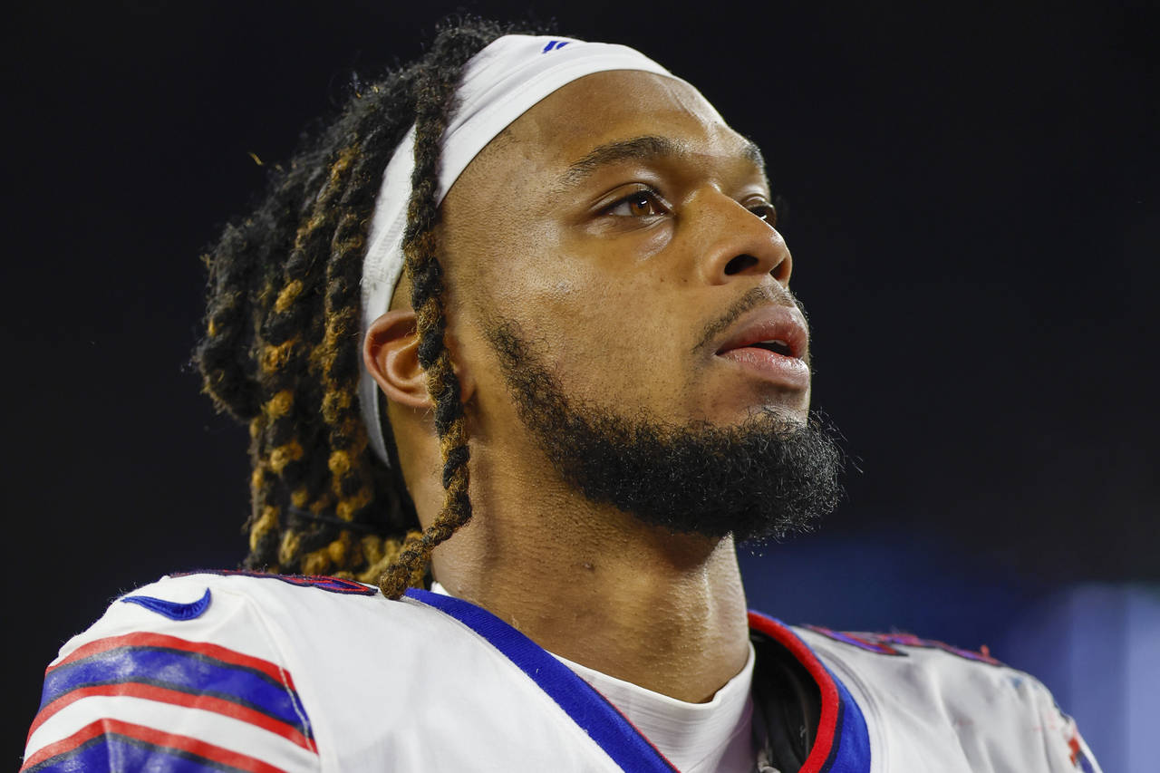 FILE - Buffalo Bills defensive back Damar Hamlin (3) leaves the field after an NFL football game ag...