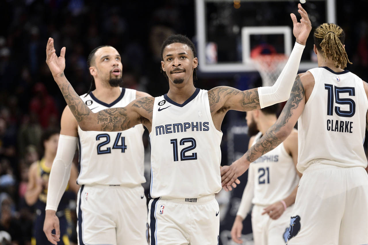 Memphis Grizzlies guard Ja Morant (12) reacts in the second half of an NBA basketball game against ...