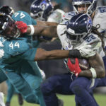 Jags return fumble for TD, beat Titans for AFC South title