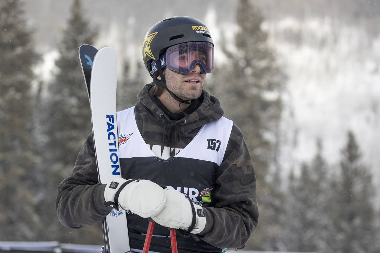 FILE - Alex Hall of the United States, checks the score following his run in the slopestyle finals,...