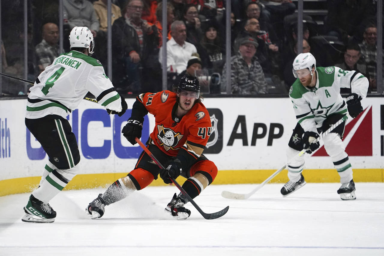 Anaheim Ducks left wing Max Comtois (44) skates to the puck past Dallas Stars defenseman Miro Heisk...