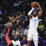 James has triple-double, leads Lakers past Knicks in OT