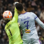 Bruised Ronaldo scores twice to edge showdown with Messi