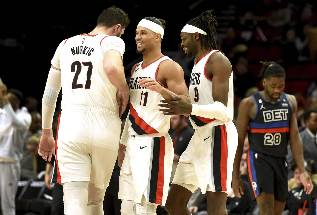 Portland Trail Blazers center Jusuf Nurkic, left, guard Josh Hart, center, and forward Jerami Grant...