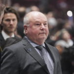Oilers beat reeling Canucks 4-2 for 6th straight victory.