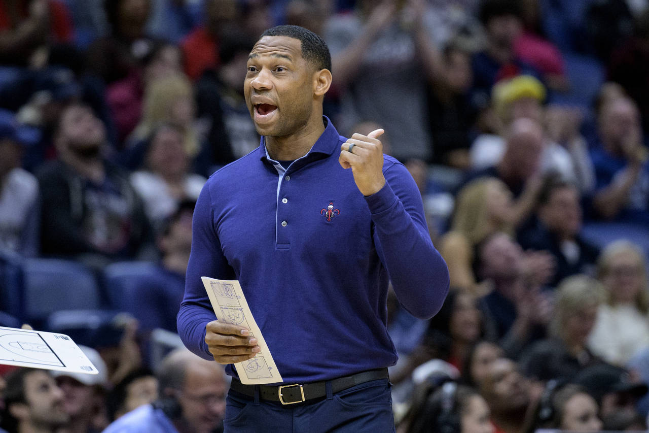 New Orleans Pelicans head coach Willie Green calls out to his team in the first half of an NBA bask...