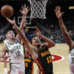 Holiday, Lopez help Bucks hold off Hawks, 114-105