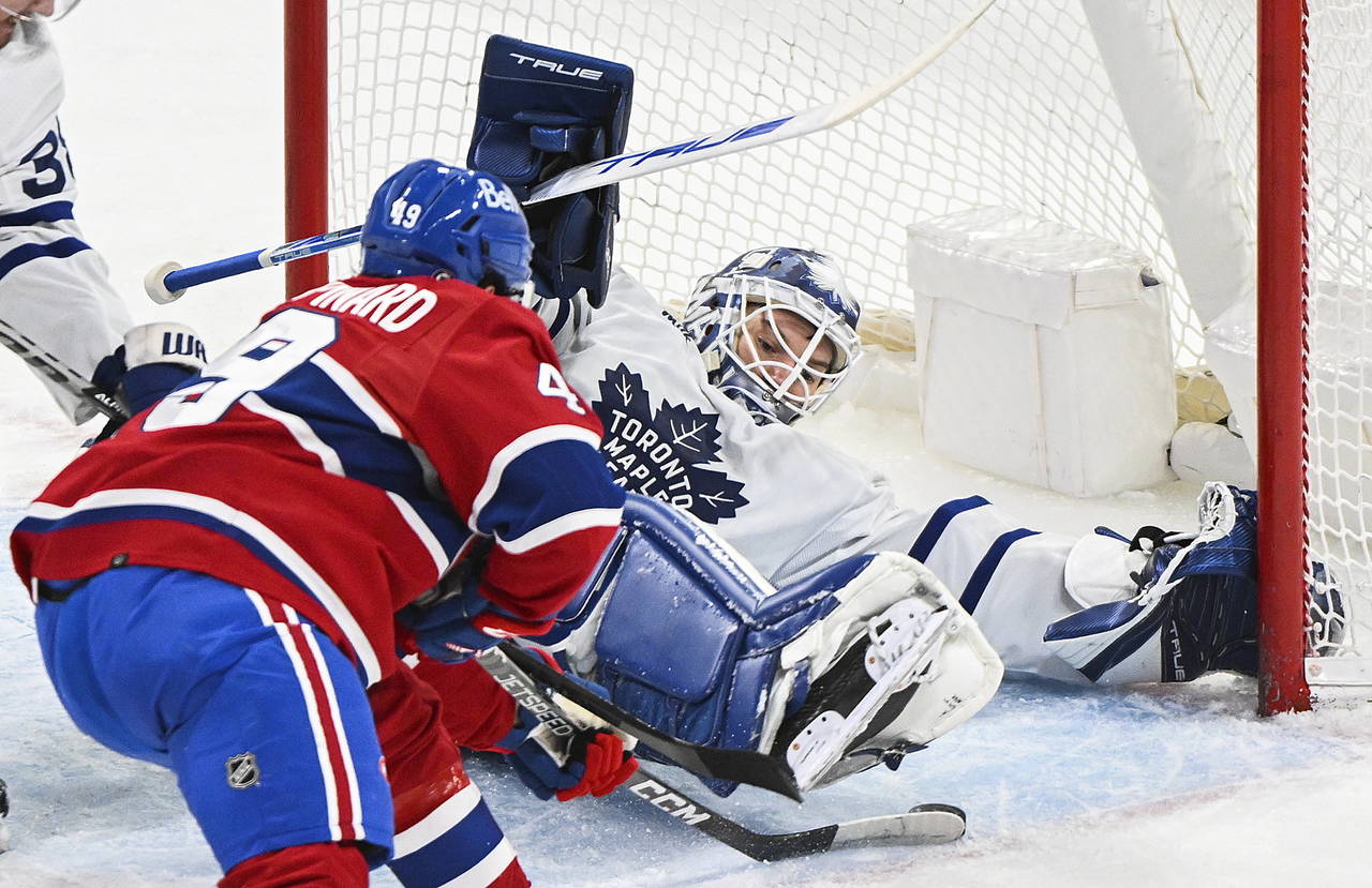 Montreal Canadiens' Rafael Harvey-Pinard is stopped by Toronto Maple Leafs goaltender Ilya Samsonov...