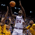 Adams scores late, No. 2 Kansas edges No. 14 Iowa St 62-60