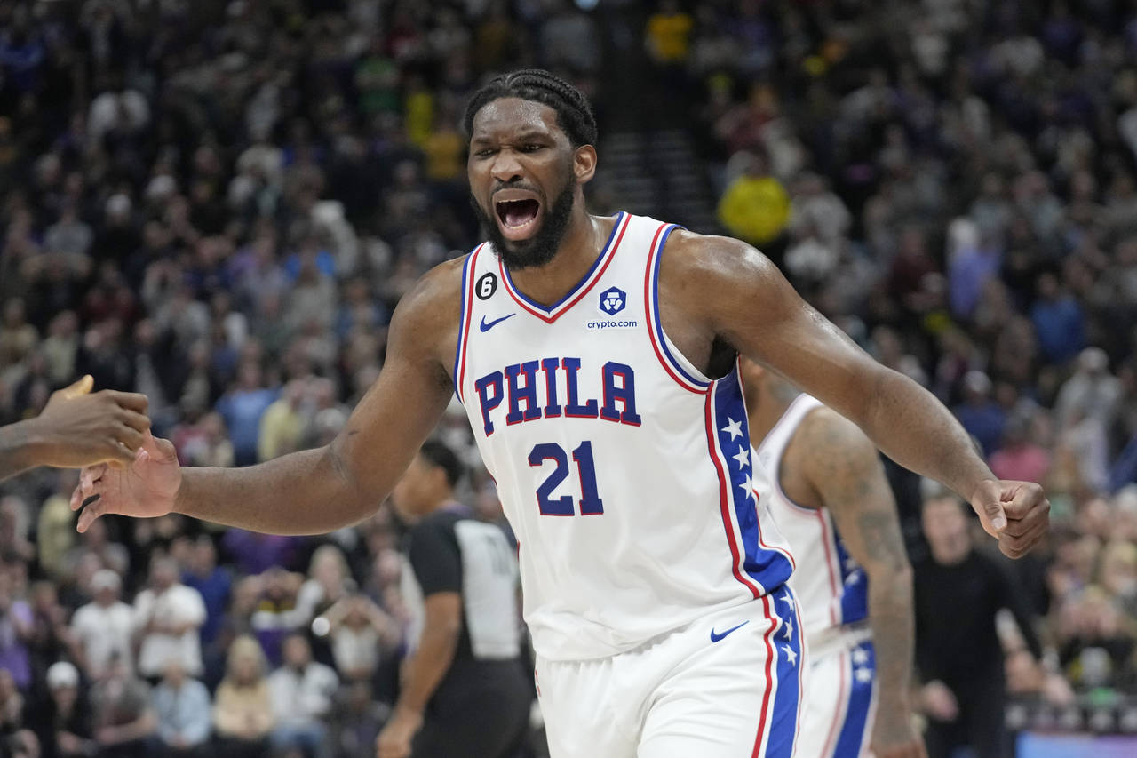 Philadelphia 76ers center Joel Embiid (21) celebrates following a victory over the Utah Jazz in an ...