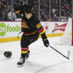 Canucks beat Blackhawks 5-2 in Tocchet's debut as coach