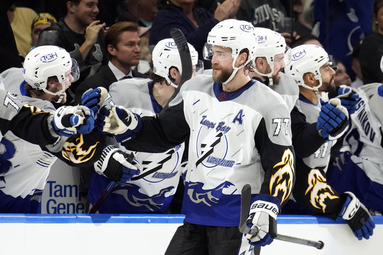 Tampa Bay Lightning defenseman Victor Hedman (77) celebrates with the bench after scoring against t...